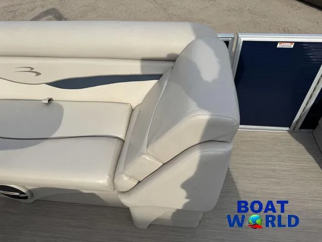Slide: The Image of 2017 Bennington 21SSX Pontoon boat seat with beige upholstery and logo. - 20