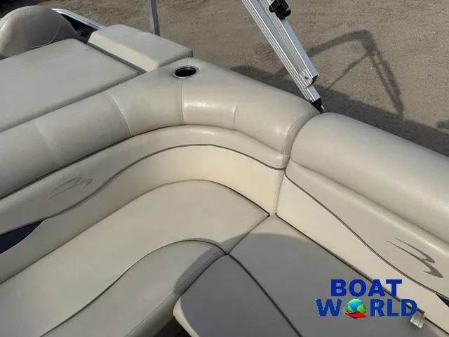 Slide: The Image of 2017 Bennington 21SSX Pontoon boat interior with beige seating and cup holder. - 23