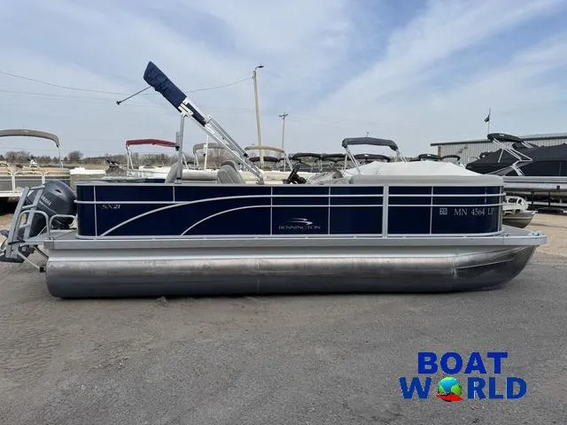 Slide: The Image of 2017 Bennington 21SSX Pontoon boat in a parking lot, side view. - 25
