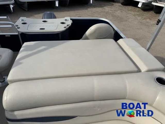 Slide: The Image of 2017 Bennington 21SSX Pontoon boat with beige seating, cup holder, and table. - 26