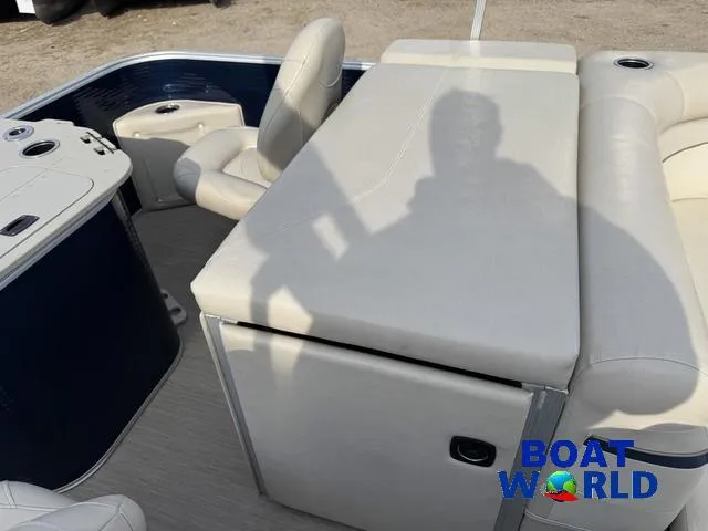 Slide: The Image of 2017 Bennington 21SSX Pontoon interior with beige seating and console, Boat World logo visible. - 27