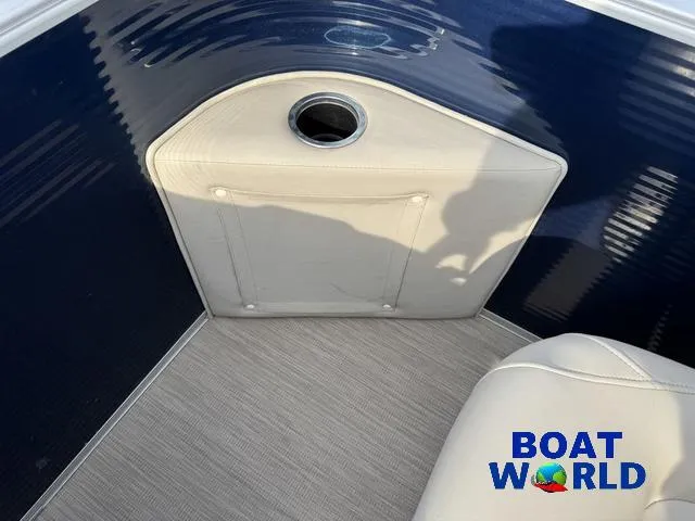 Slide: The Image of 2017 Bennington 21SSX Pontoon interior with blue and beige design, featuring Boat World logo. - 35