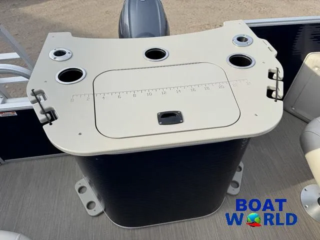 Slide: The Image of 2017 Bennington 21SSX Pontoon boat console with cup holders and storage compartment. - 36