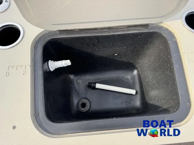 Slide: The Image of 2017 Bennington 21SSX Pontoon storage compartment with accessories, featuring Boat World logo. - 37