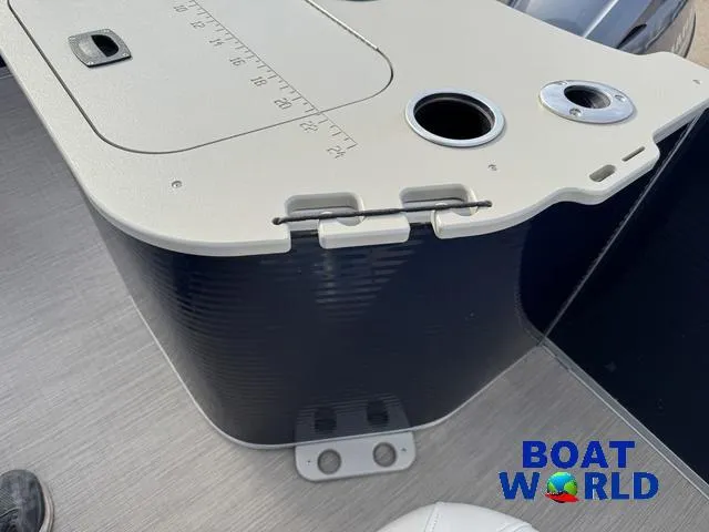 Slide: The Image of 2017 Bennington 21SSX Pontoon boat console with cup holders and storage compartment. - 38