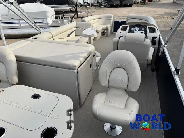 Slide: The Image of 2017 Bennington 21SSX Pontoon boat interior with seating and helm, displayed at Boat World. - 39