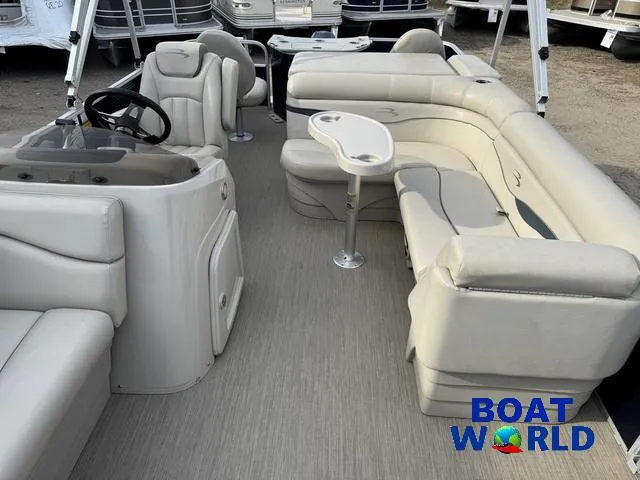 Slide: The Image of 2017 Bennington 21SSX Pontoon with beige seating and steering console at Boat World. - 4