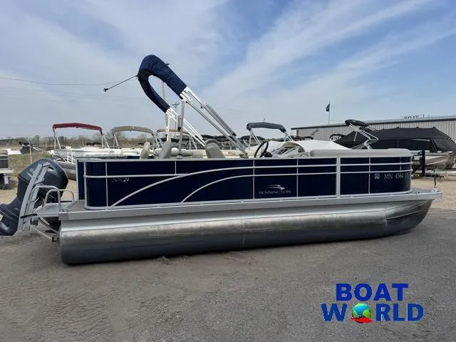 Slide: The Image of 2017 Bennington 21SSX Pontoon boat with blue exterior, displayed at Boat World dealership. - 41