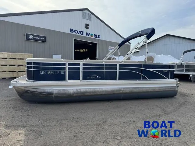 Slide: The Image of 2017 Bennington 21SSX Pontoon boat parked outside Boat World dealership. - 47