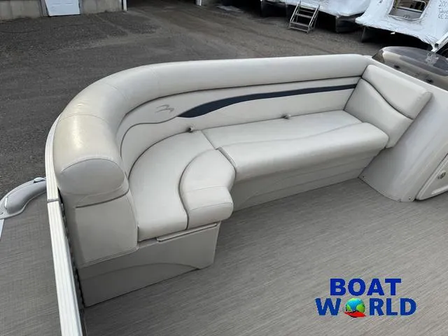 Slide: The Image of 2017 Bennington 21SSX Pontoon boat with beige seating, showcased at Boat World. - 9