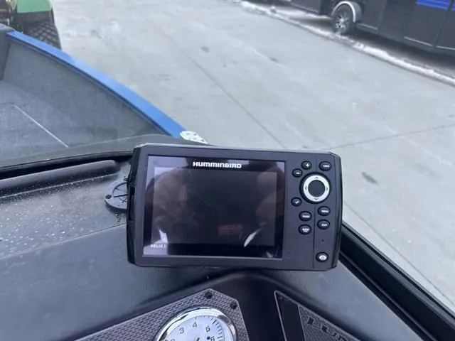 Slide: The Image of Fishfinder on 2024 Lund 1650 Angler Sport boat dashboard, outdoor setting. - 9