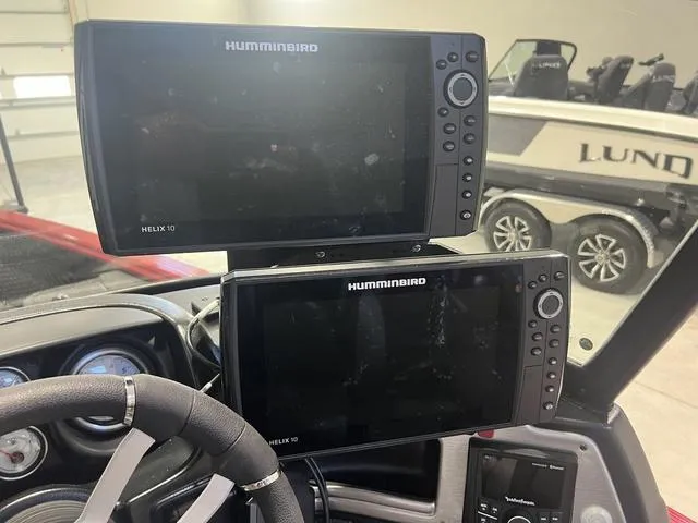 Slide: The Image of 2024 Lund 2025 Impact XS Sport boat with Humminbird Helix 10 fish finders. - 14