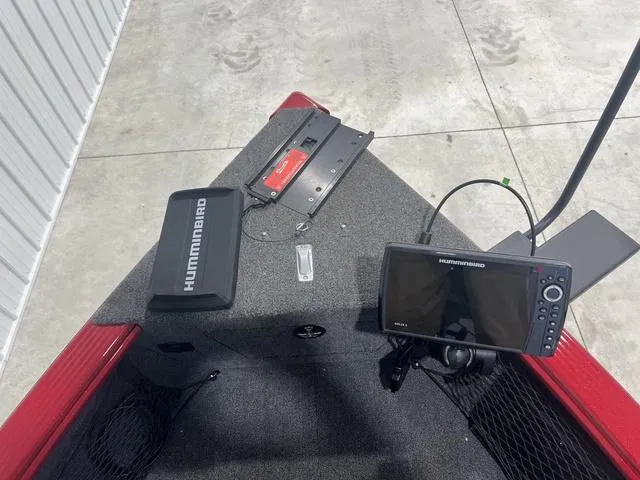 Slide: The Image of 2024 Lund 2025 Impact XS Sport boat with Humminbird electronics on deck. - 5