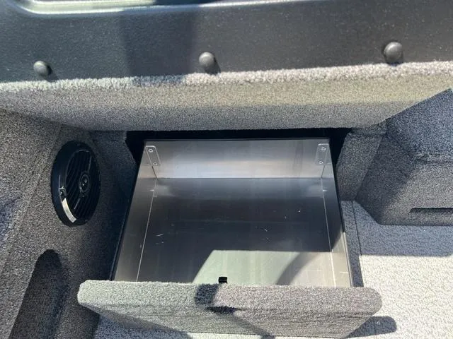 Slide: The Image of Open storage compartment in 2024 Lund 2025 Impact XS Sport boat interior. - 12