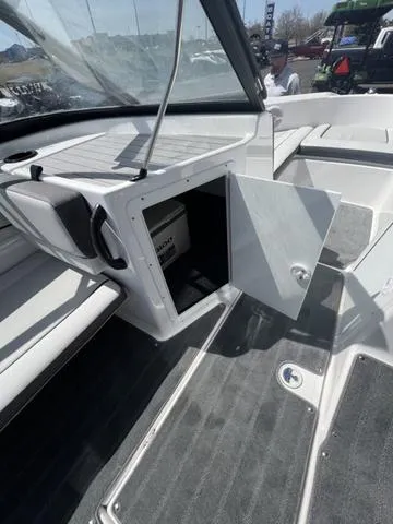 Slide: The Image of 2024 Yamaha AR190 boat interior with open storage compartment and seating area. - 12