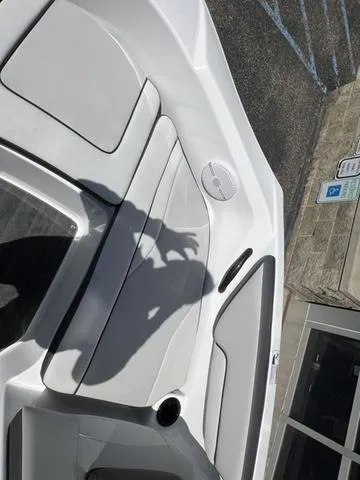 Slide: The Image of 2024 Yamaha Boats AR190 interior with seating and speaker, shadow visible. - 22