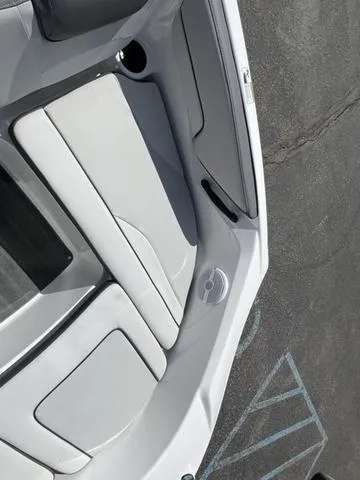 Slide: The Image of 2024 Yamaha Boats AR190 interior with sleek white seating and modern design. - 23