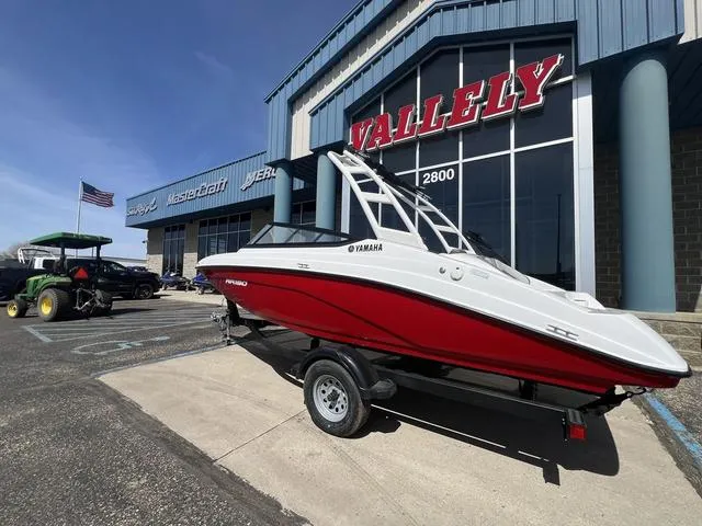 Slide: The Image of 2024 Yamaha AR190 boat in red, displayed outside a dealership with "Valley" signage. - 3