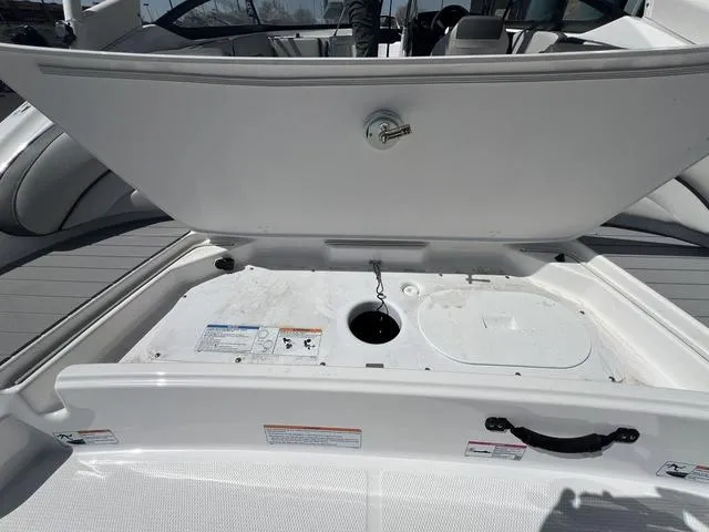 Slide: The Image of 2024 Yamaha Boats AR190 storage compartment open, showcasing interior details and design features. - 7
