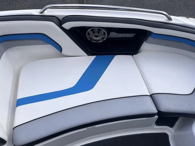Slide: The Image of 2016 Yamaha Boats 242X E-Series interior seating with blue and white upholstery. - 14