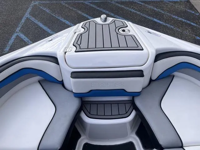 Slide: The Image of 2016 Yamaha Boats 242X E-Series bow seating with gray and blue upholstery. - 15