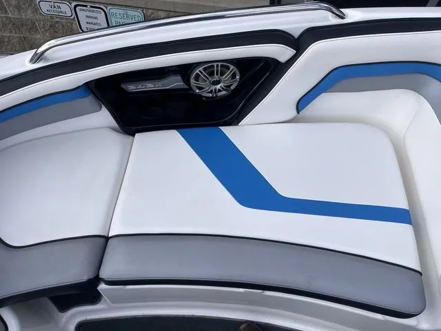 Slide: The Image of 2016 Yamaha Boats 242X E-Series interior with blue and gray seating. - 16