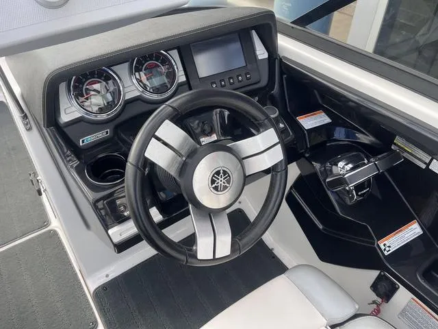 Slide: The Image of 2016 Yamaha Boats 242X E-Series dashboard with steering wheel and control panel. - 19