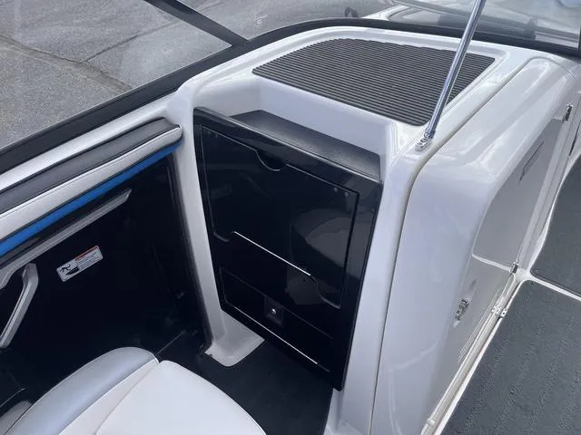 Slide: The Image of Interior of 2016 Yamaha Boats 242X E-Series, featuring sleek storage compartments and seating. - 20