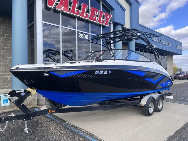 Slide: The Image of 2016 Yamaha Boats 242X E-Series on trailer outside Vallely dealership. - 3