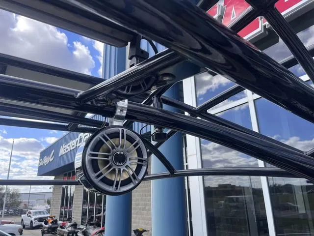 Slide: The Image of Close-up of 2016 Yamaha Boats 242X E-Series speaker and frame against a cloudy sky. - 31