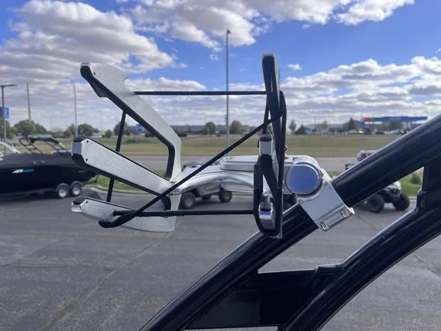 Slide: The Image of Wakeboard rack on a 2016 Yamaha Boats 242X E-Series under a cloudy sky. - 36