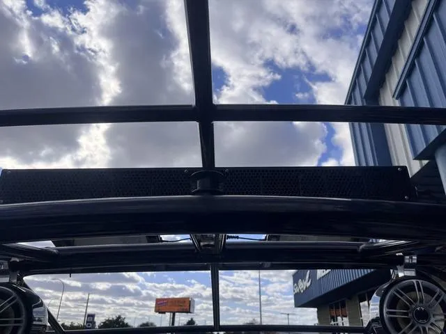 Slide: The Image of Rooftop view of 2016 Yamaha Boats 242X E-Series against a cloudy sky. - 37