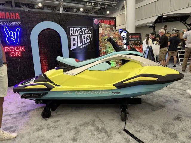 Slide: The Image of 2025 Yamaha WaveRunner JetBlaster Pro 3-Up on display at an indoor event. - 13