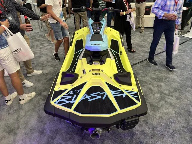 Slide: The Image of 2025 Yamaha WaveRunner JetBlaster Pro 3-Up on display at an event, surrounded by attendees. - 17