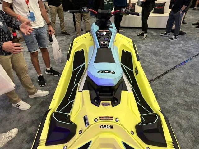Slide: The Image of 2025 Yamaha WaveRunner JetBlaster Pro 3-Up on display at an event, surrounded by attendees. - 20