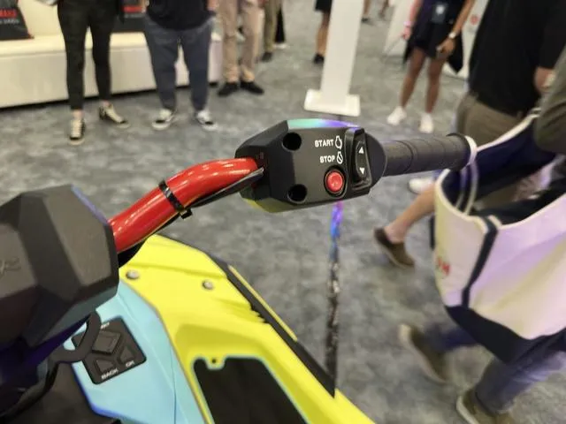 Slide: The Image of 2025 Yamaha WaveRunner JetBlaster Pro 3-Up handlebar with start/stop controls at a showcase event. - 28