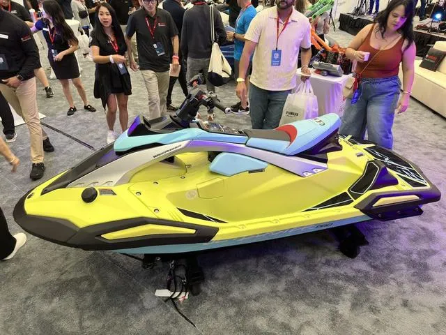 Slide: The Image of 2025 Yamaha WaveRunner JetBlaster Pro 3-Up on display at an event, surrounded by attendees. - 34
