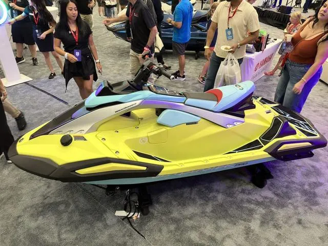 Slide: The Image of 2025 Yamaha WaveRunner JetBlaster Pro 3-Up on display at an event, surrounded by attendees. - 35