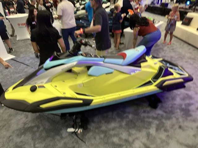 Slide: The Image of 2025 Yamaha WaveRunner JetBlaster Pro 3-Up on display at a crowded event. - 36