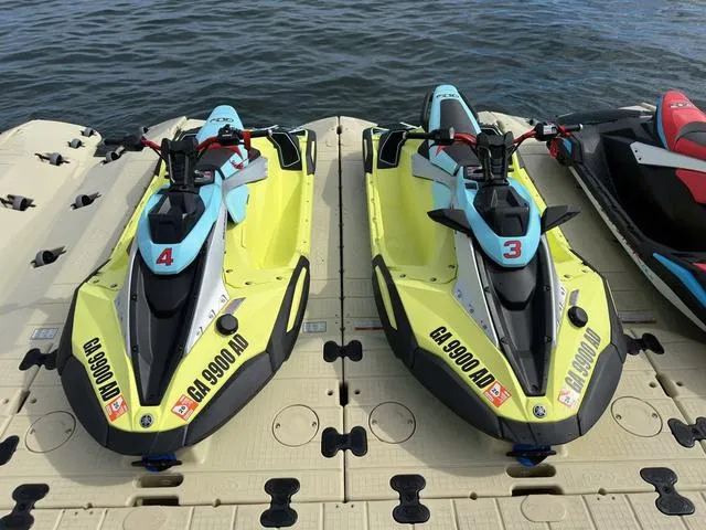 Slide: The Image of 2025 Yamaha WaveRunner JetBlaster Pro 3-Up jet skis docked on water. - 38