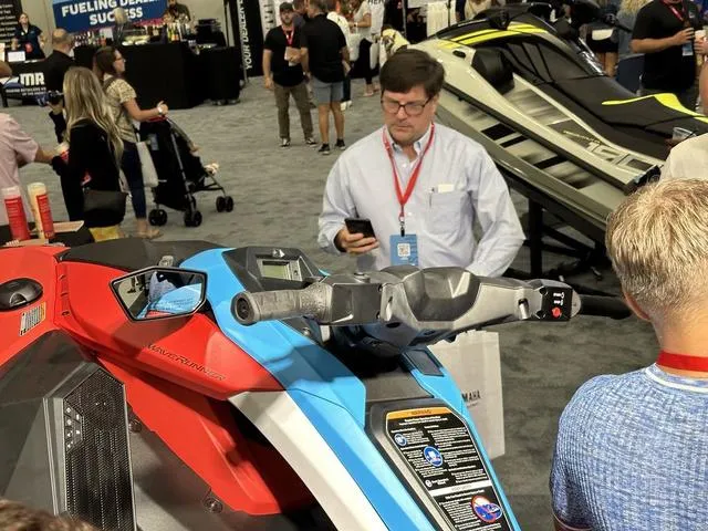 Slide: The Image of 2025 Yamaha WaveRunner Jetblaster on display at a trade show, attracting attendees' attention. - 7