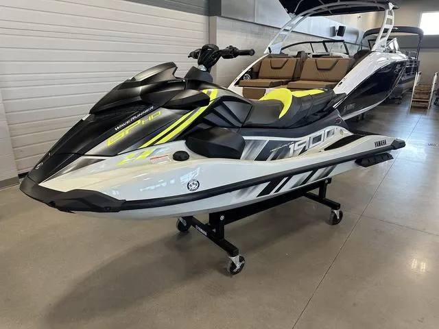 Slide: The Image of 2025 Yamaha Waverunners GP jet ski in showroom, featuring sleek design and modern aesthetics. - 1