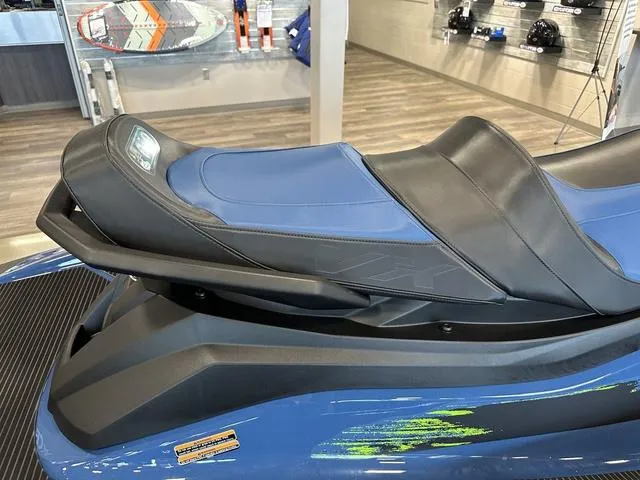 Slide: The Image of 2025 Yamaha Waverunner VX Cruiser HO, blue seat detail in showroom setting. - 7