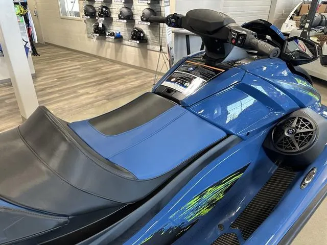Slide: The Image of 2025 Yamaha Waverunner VX Cruiser HO in showroom, blue with sleek design and comfortable seating. - 8