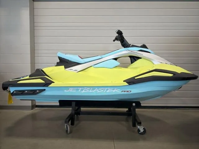 Slide: The Image of 2025 Yamaha Waverunner Jetblaster in vibrant yellow and blue, displayed indoors on a stand. - 3