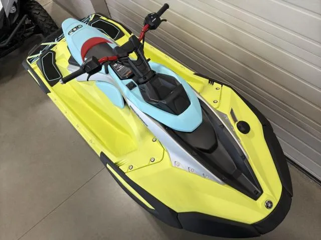 Slide: The Image of 2025 Yamaha Waverunner Jetblaster in vibrant yellow and blue, parked indoors. - 4