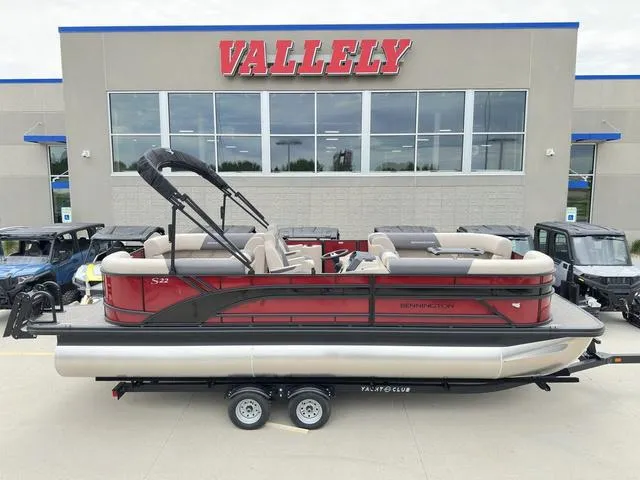 Slide: The Image of 2024 Bennington 22 SSR Tri-Toon Pontoon boat displayed at Vallely dealership. - 1