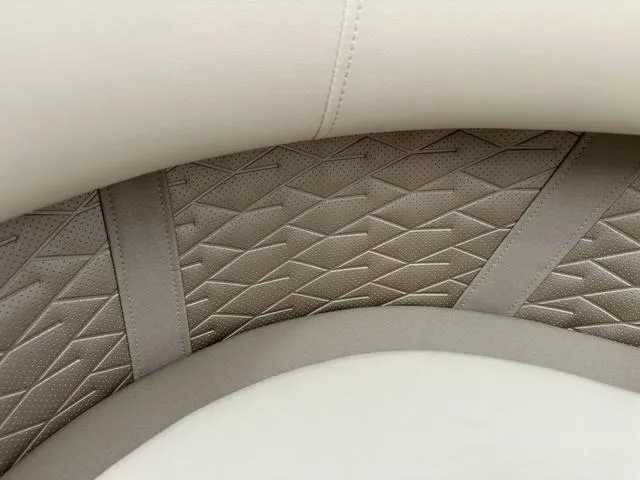 Slide: The Image of 2024 Bennington 22 SSR Tri-Toon Pontoon interior seating detail, featuring textured upholstery. - 17