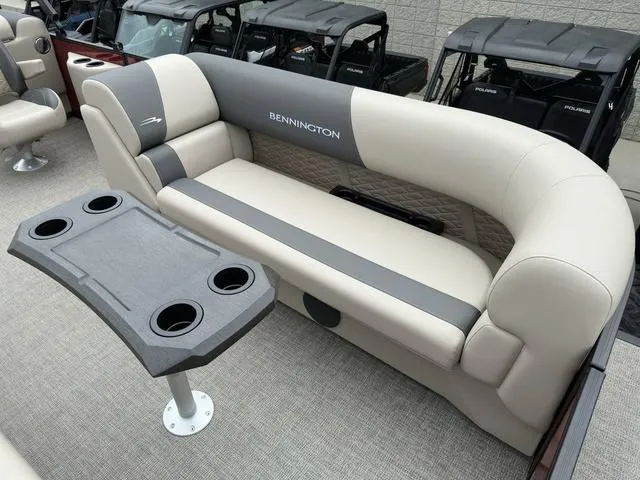 Slide: The Image of 2024 Bennington 22 SSR Tri-Toon Pontoon with plush seating and cupholder table. - 19
