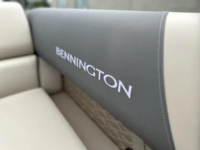 Slide: The Image of 2024 Bennington 22 SSR Tri-Toon Pontoon seat with logo, featuring elegant upholstery. - 20